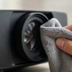 How To Clean Projector Lens 2026 – DIY Projector Guide Cleaning a projector lens with a microfiber cloth