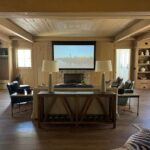 Living room home theater with projector screen