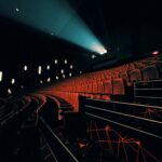 Projector beam lighting up a dark cinema