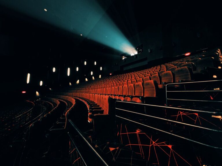 Projector beam lighting up a dark cinema